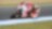 Un pilote sur une moto de course Ducati dans un virage en épingle