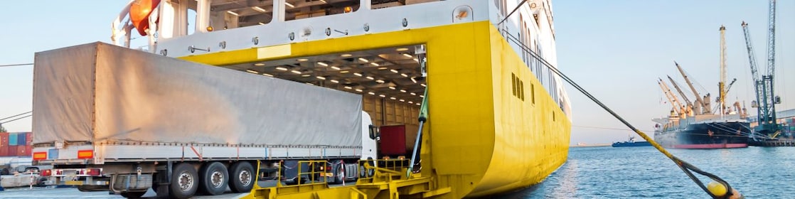 Large truck being loaded onto a ferry