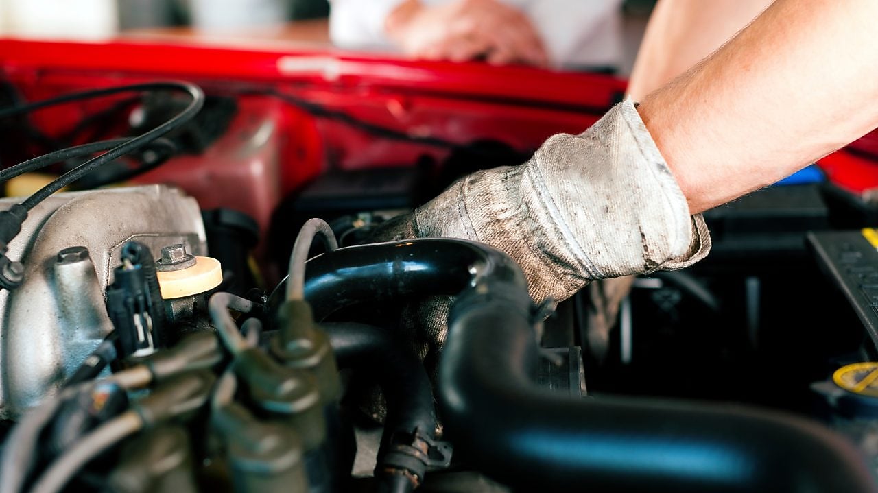 Car mechanic in repair shop