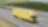 Blue sky over yellow truck on a highway