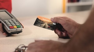 person with shell card