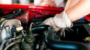 Car mechanic in repair shop
