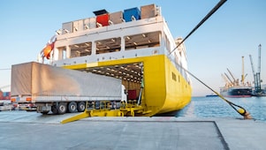 Large truck being loaded onto a ferry