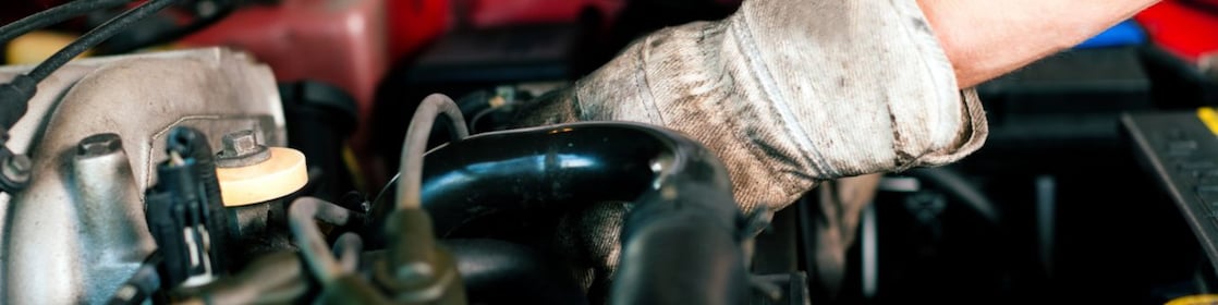 Car mechanic in repair shop