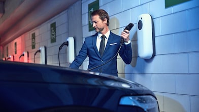 man filling electric in the car