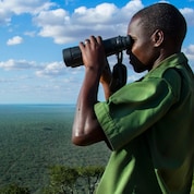 Man watching through binocular