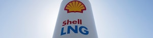 A large white tower with a Shell lng logo on the side,Shell Venster 2 2015-Cover LNG